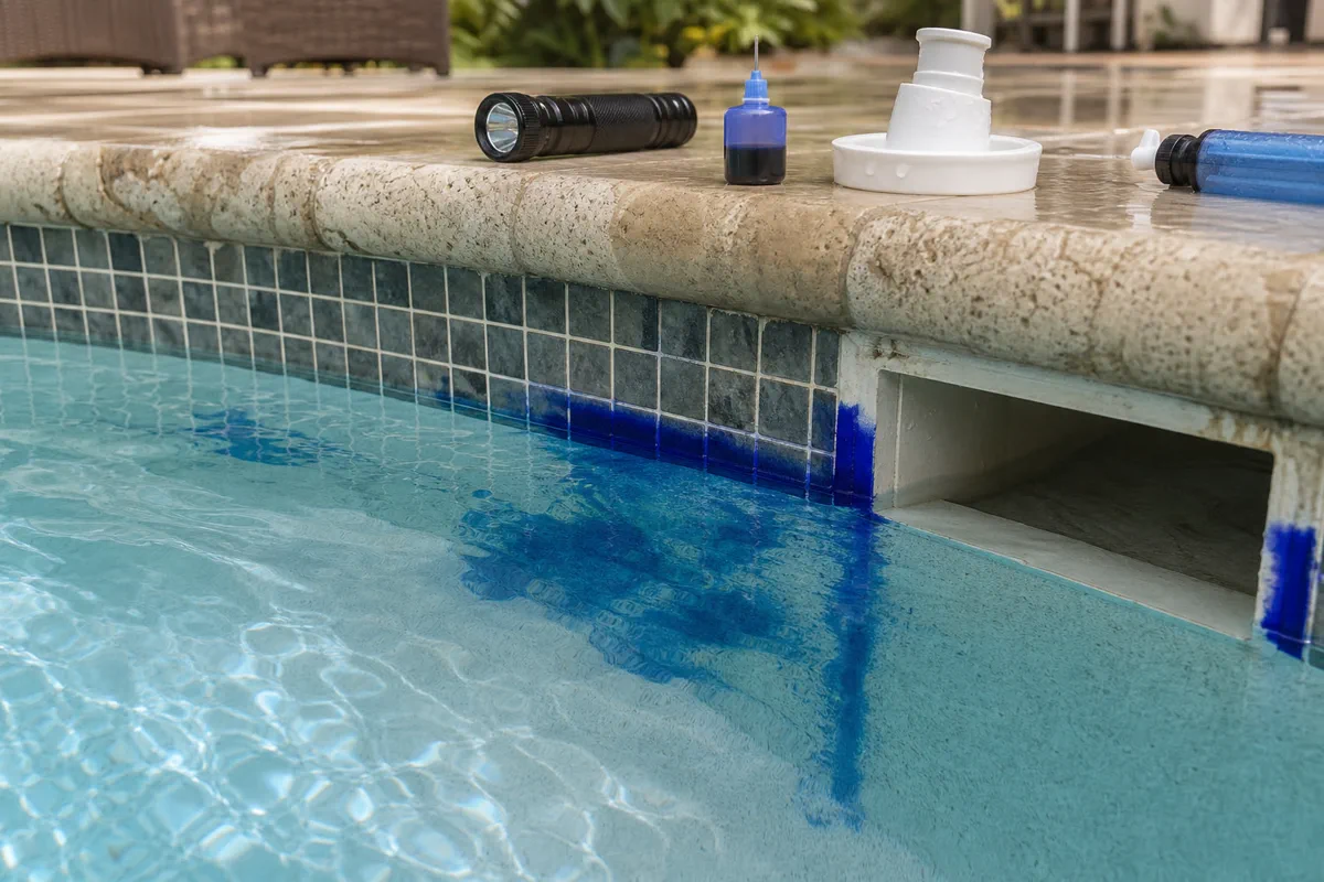 Close view of a pool fitting area checked during leak detection